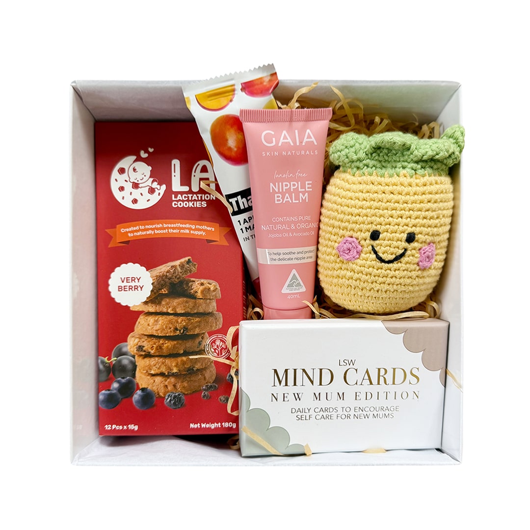 New mum gift set with healthy snacks and a soft rattle for baby